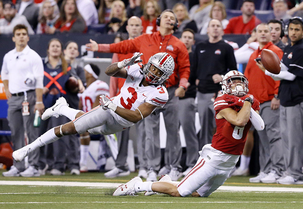 Sports - 1st place   - Wisconsin wide receiver Danny Davis III (6) can't catch a pass while defended by Ohio State cornerback Damon Arnette (3) during the second half of the Big Ten Championship game at Lucas Oil Stadium in Indianapolis. (Barbara J. Perenic / The Columbus Dispatch)